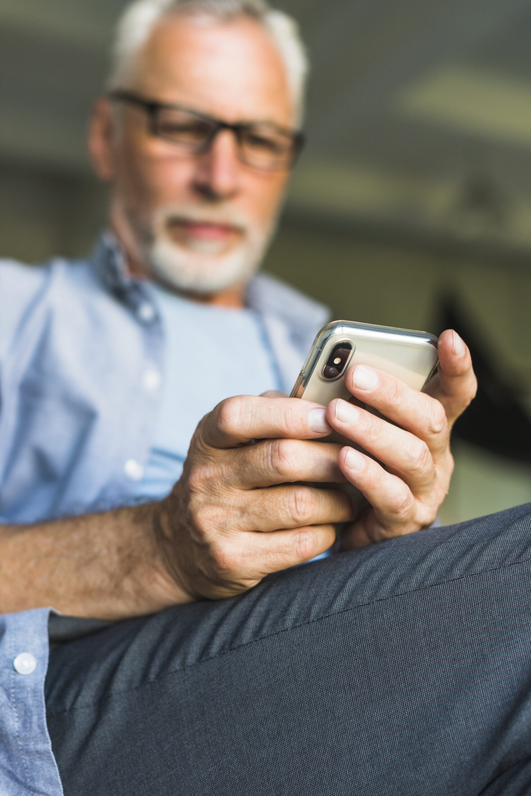 close-up-senior-man-s-hand-holding-mobile-phone